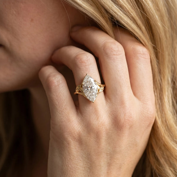 Yellow gold Marquise Cut Diamond Solitaire Ring with Twist Band and Four-Prong Setting