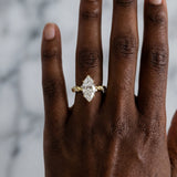 Yellow gold Marquise Cut Diamond Solitaire Ring with Twisted Band and Pavé Accents_52