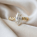 Yellow gold Marquise Cut Diamond Solitaire Ring with Twisted Band and Pavé Accents_55