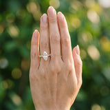Yellow gold Marquise Cut Diamond Solitaire with Side Stones on a Pavé Band and Four-Prong Setting_109
