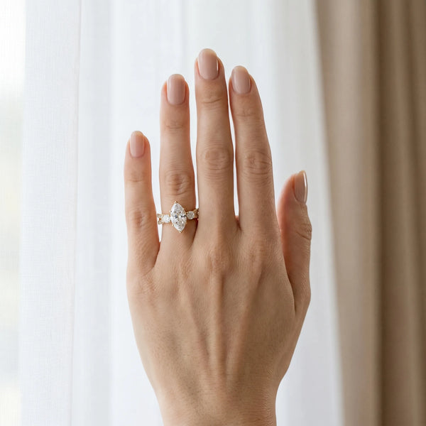 Yellow gold Marquise Cut Diamond Three-Stone Ring with Pavé Split Shank and Four-Prong Setting