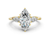 10K Yellow Gold 4.04 Carat E VVS2 Marquise Diamond Three-Stone Ring with Pear Side Stones and Four-Prong Setting