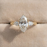 14K Yellow Gold 4.04 Carat F VVS2 Marquise Diamond Three-Stone Ring with Pear Side Stones and Prong Setting