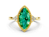 Yellow gold Marquise Cut Emerald Halo Ring with Tapered Band and Four-Prong Setting