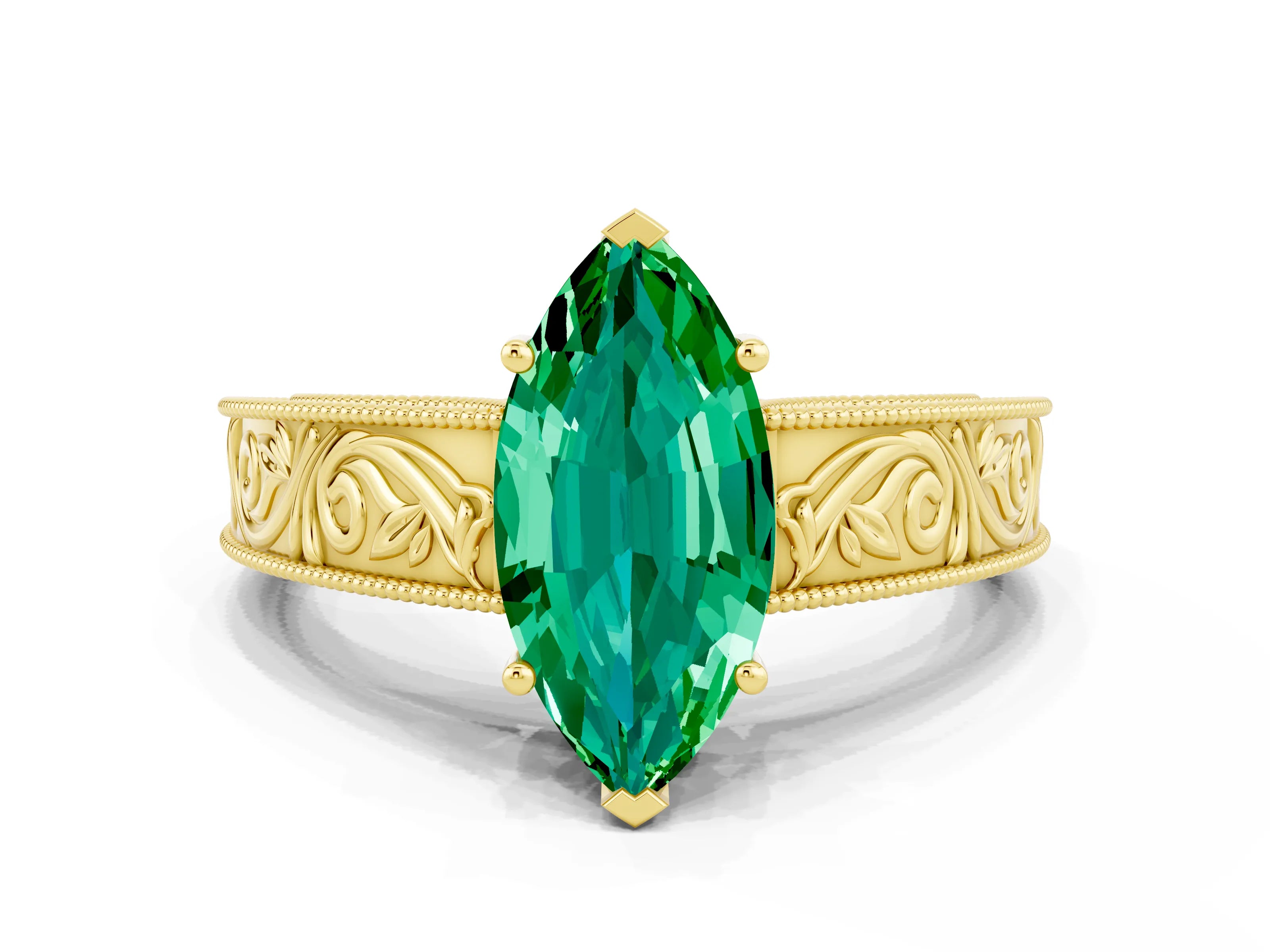 Yellow gold Marquise Cut Emerald Solitaire Ring with Engraved Band and Four-Prong Setting