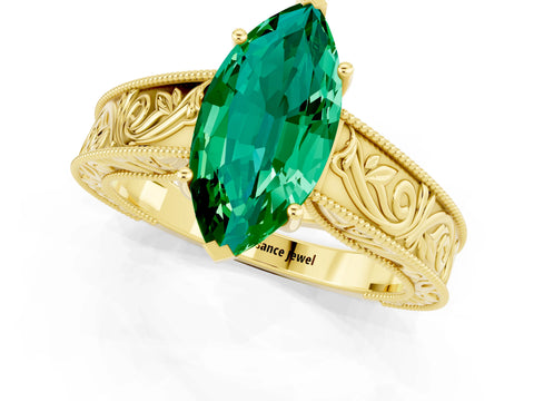 Yellow gold Marquise Cut Emerald Solitaire Ring with Engraved Band and Four-Prong Setting_1