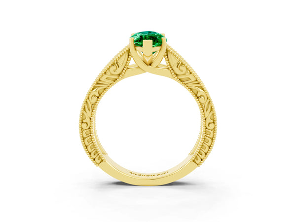 Yellow gold Marquise Cut Emerald Solitaire Ring with Engraved Band and Four-Prong Setting