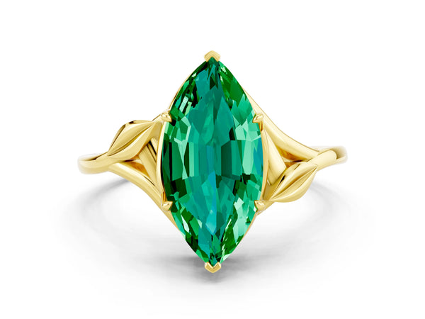 Yellow gold Marquise Cut Emerald Solitaire Ring with Twist Band and Four-Prong Setting