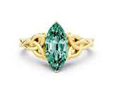 Yellow gold Marquise Cut Green Sapphire Solitaire Engagement Ring with Celtic Knot Band and Four-Prong Setting