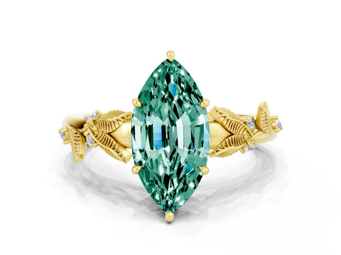 Yellow gold Marquise Cut Green Sapphire Solitaire Ring with Leaf Motif Band and Four-Prong Setting