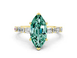 Yellow gold Marquise Cut Green Sapphire Solitaire with Side Baguettes and Channel Set Band