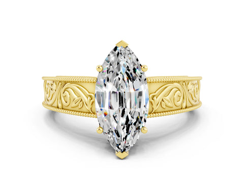 Yellow gold Marquise Cut Moissanite Solitaire Ring with Engraved Band and Four-Prong Setting