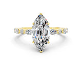 Yellow gold Marquise Cut Moissanite Solitaire with Side Stones on a Pavé Band and Four-Prong Setting