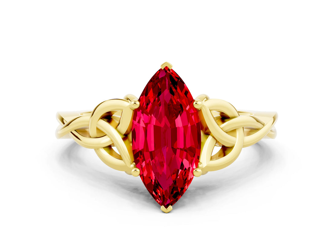 Yellow gold Marquise Cut Ruby Solitaire Engagement Ring with Celtic Knot Band and Four-Prong Setting
