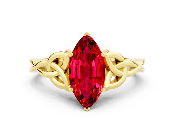 Yellow gold Marquise Cut Ruby Solitaire Engagement Ring with Celtic Knot Band and Four-Prong Setting