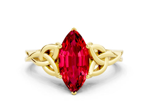 Yellow gold Marquise Cut Ruby Solitaire Engagement Ring with Celtic Knot Band and Four-Prong Setting