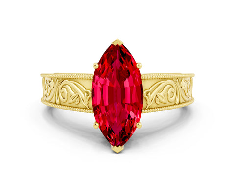 Yellow gold Marquise Cut Ruby Solitaire Ring with Engraved Band and Four-Prong Setting