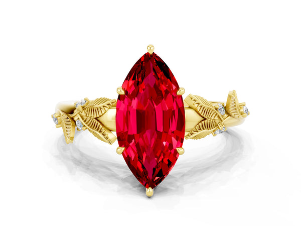 Yellow gold Marquise Cut Ruby Solitaire Ring with Leaf Motif Band and Four-Prong Setting