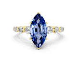 Yellow gold Marquise Cut Solitaire Blue Sapphire Ring with Pave Band and Four-Prong Setting