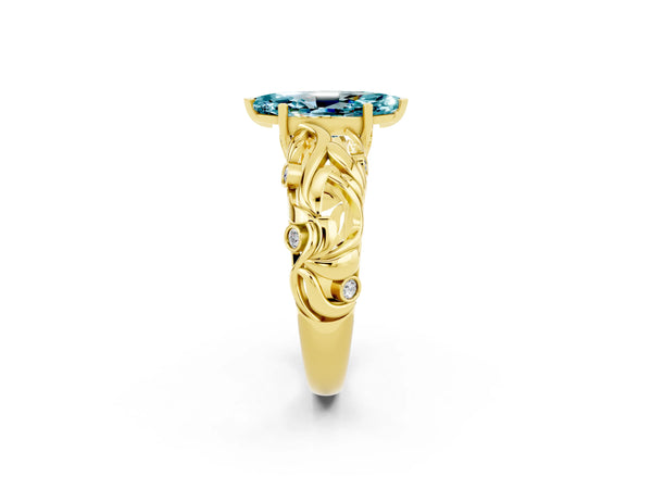 Yellow gold Marquise Cut Solitaire Blue Topaz Leaf-Inspired Vine Band Ring with Prong Setting