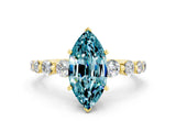 Yellow gold Marquise Cut Solitaire Blue Topaz Ring with Pave Band and Four-Prong Setting