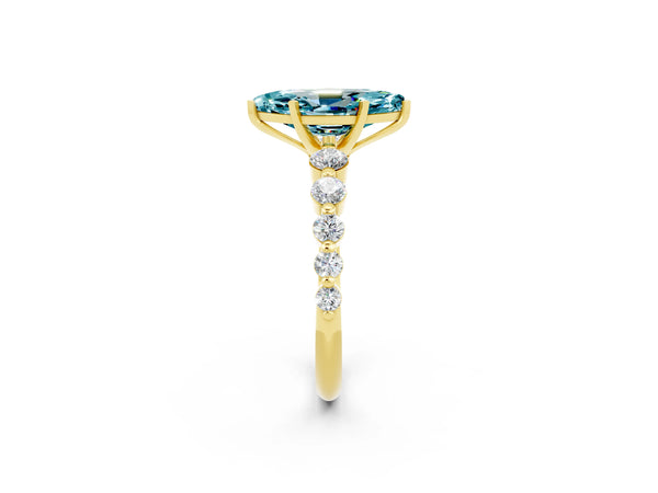 Yellow gold Marquise Cut Solitaire Blue Topaz Ring with Pave Band and Four-Prong Setting