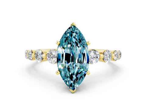 Yellow gold Marquise Cut Solitaire Blue Topaz Ring with Pave Band and Four-Prong Setting