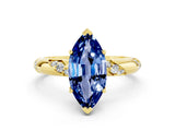 Yellow gold Marquise Cut Solitaire Diamond Engagement Ring with Twisted Pave Band and Four-Prong Setting