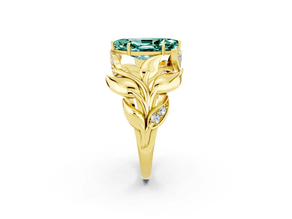 Yellow gold Marquise Cut Green Sapphire Leaf-Inspired Engagement Ring with Round Accents and Prong Setting