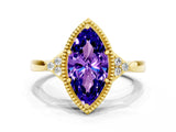 Yellow gold Marquise Cut Tanzanite Halo Ring with Tapered Band and Four-Prong Setting