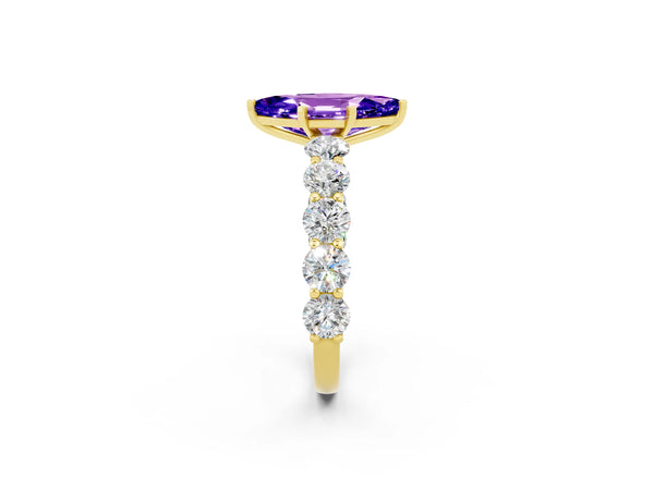 Yellow gold Marquise Cut Tanzanite Prong Setting with Side Stones on a Pave Band