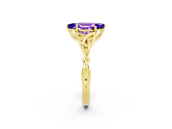Yellow gold Marquise Cut Tanzanite Solitaire Celtic Knot Ring with Four-Prong Setting