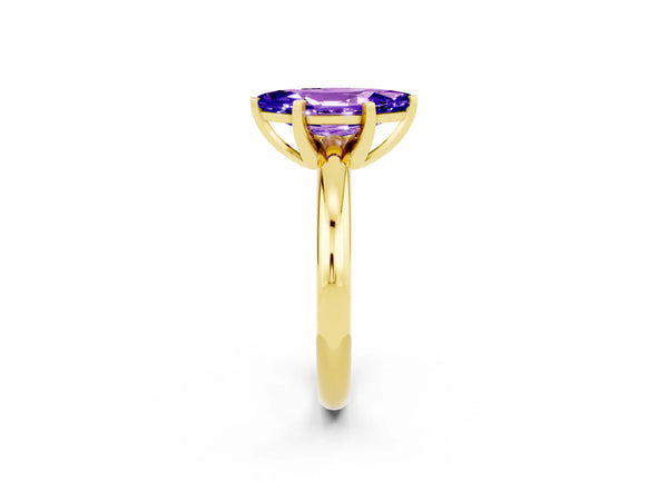 Yellow gold Marquise Cut Tanzanite Solitaire Engagement Ring with Round Band and Four-Prong Setting