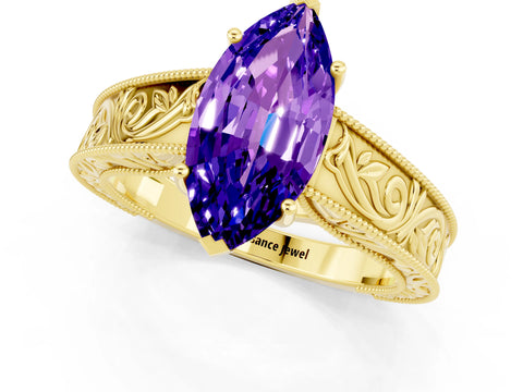 Yellow gold Marquise Cut Tanzanite Solitaire Ring with Engraved Band and Four-Prong Setting_1