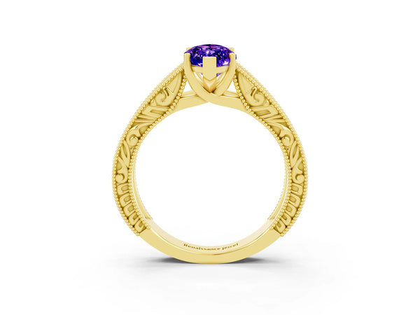 Yellow gold Marquise Cut Tanzanite Solitaire Ring with Engraved Band and Four-Prong Setting