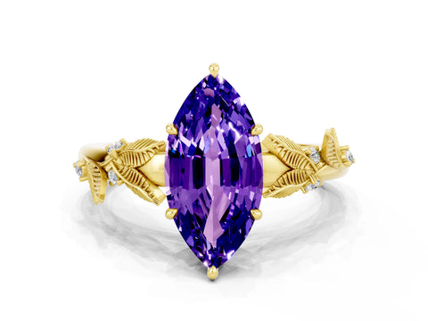 Yellow gold Marquise Cut Tanzanite Solitaire Ring with Leaf Motif Band and Four-Prong Setting
