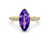 Yellow gold Marquise Cut Tanzanite Solitaire Ring with Pavé Accents and Four-Prong Setting