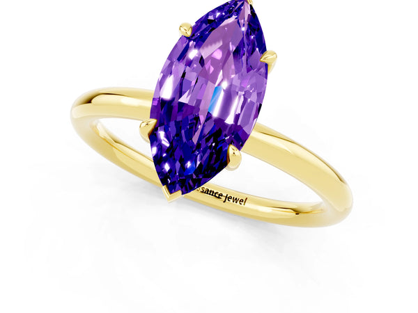 Yellow gold Marquise Cut Tanzanite Solitaire Ring with Thin Band and Four-Prong Setting