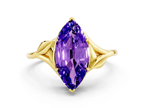 Yellow gold Marquise Cut Tanzanite Solitaire Ring with Twist Band and Four-Prong Setting