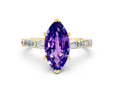 Yellow gold Marquise Cut Tanzanite Solitaire with Side Baguettes and Channel Set Band