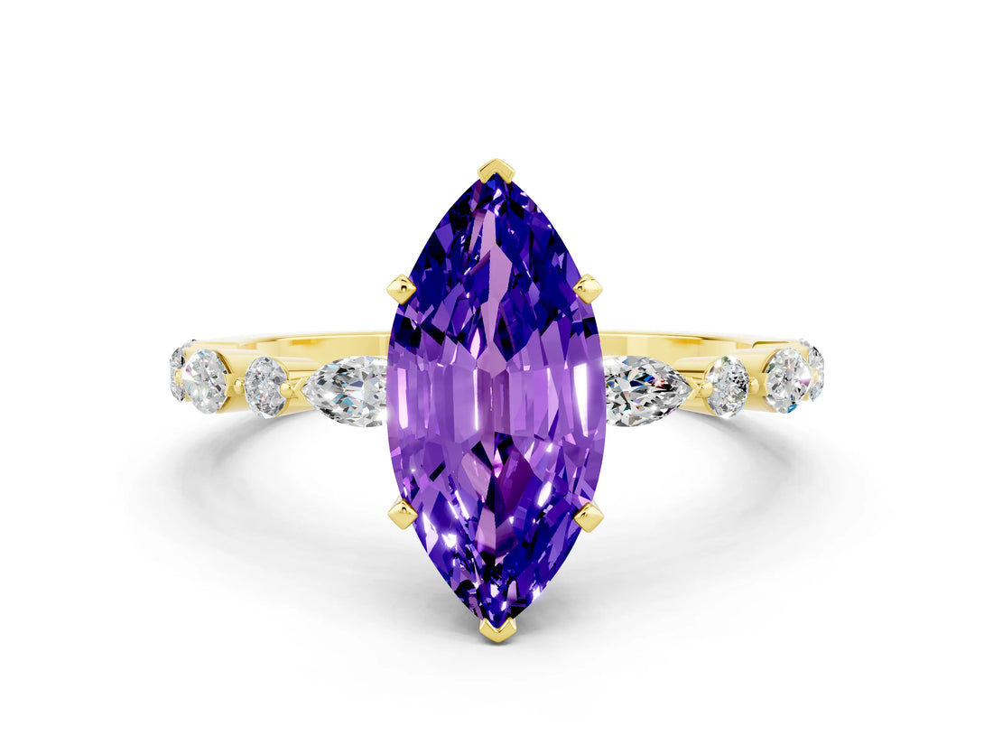 Yellow gold Marquise Cut Tanzanite Solitaire with Side Stones on a Pavé Band and Four-Prong Setting