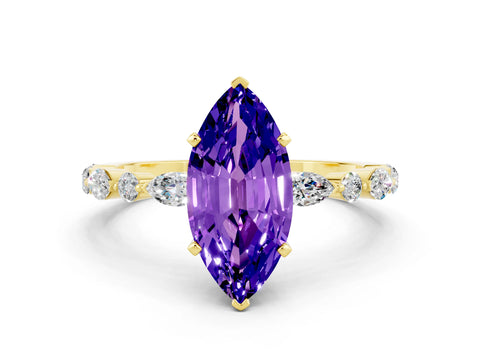 Yellow gold Marquise Cut Tanzanite Solitaire with Side Stones on a Pavé Band and Four-Prong Setting