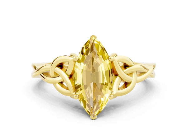 Yellow gold Marquise Cut Yellow Sapphire Solitaire Engagement Ring with Celtic Knot Band and Four-Prong Setting