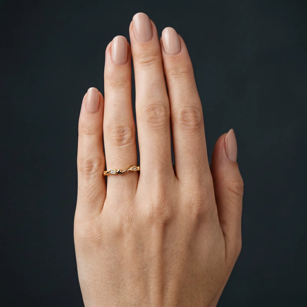 Yellow gold Marquise Diamond Leaf Twist Eternity Band with Bezel Setting