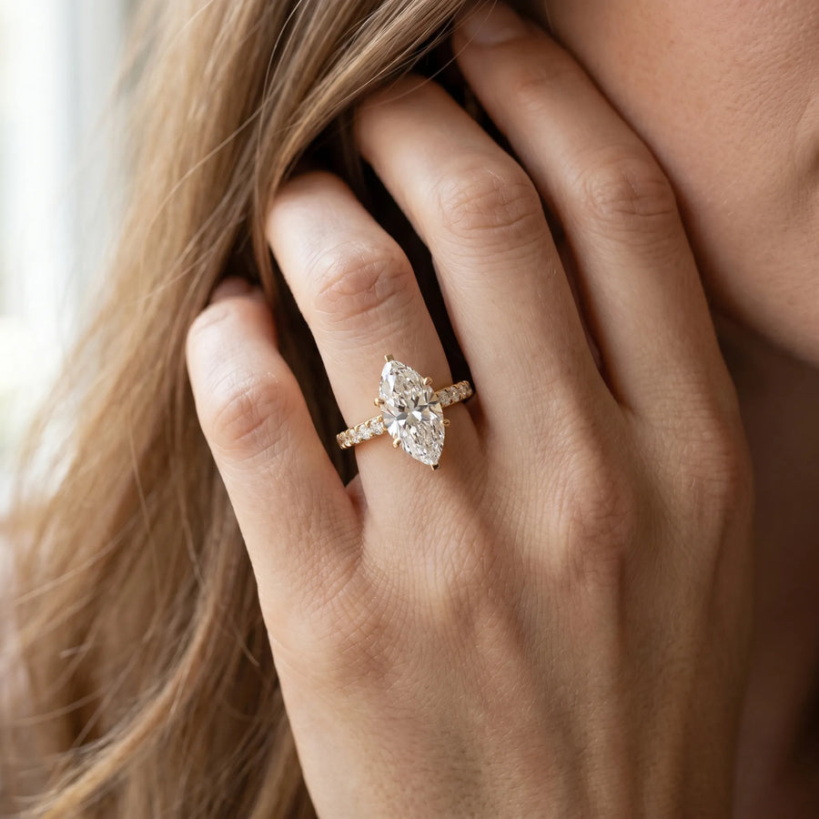 Yellow gold Marquise Diamond Solitaire Ring with Pavé Band and Prong Setting