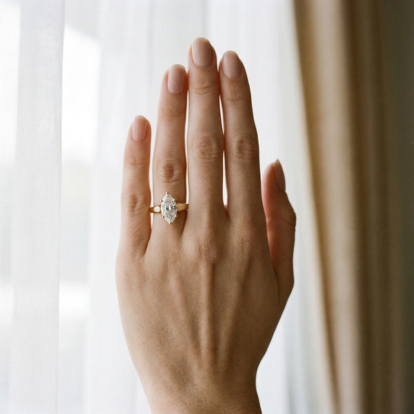 Yellow gold Marquise Diamond Solitaire Ring with Tapered Band and Prong Setting