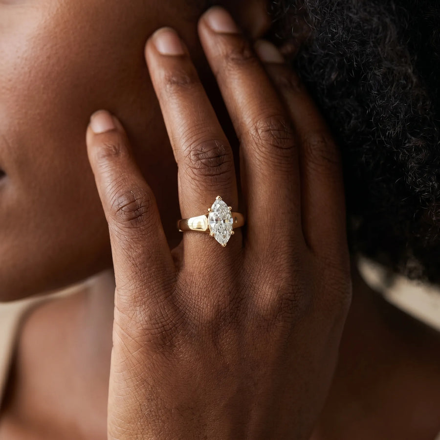 Yellow gold Marquise Diamond Solitaire Ring with Tapered Band and Prong Setting