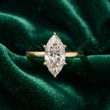 Yellow gold Marquise Solitaire Diamond Engagement Ring with Four-Prong Setting on a Classic Band_16