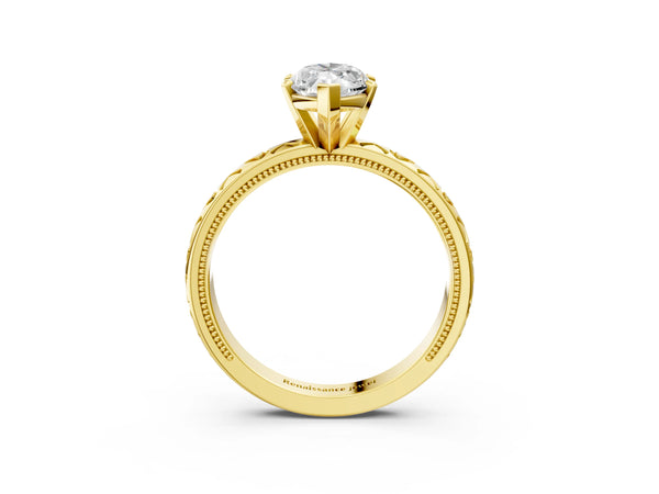 Yellow gold Marquise Solitaire Diamond Engagement Ring with XO Engraved Band and Four-Prong Setting