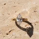 Yellow gold Marquise Solitaire Diamond Engagement Ring with XO Engraved Band and Four-Prong Setting_15